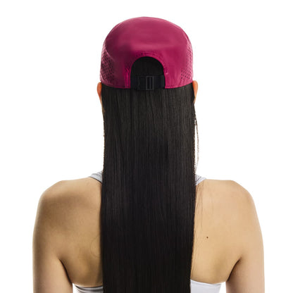 Rear view of female model wearing the On Lightweight Cap in Grenadine showing adjustable strap 