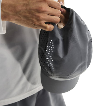 Close-up of interior detail and strap adjustment of the On Lightweight Cap in Rock 