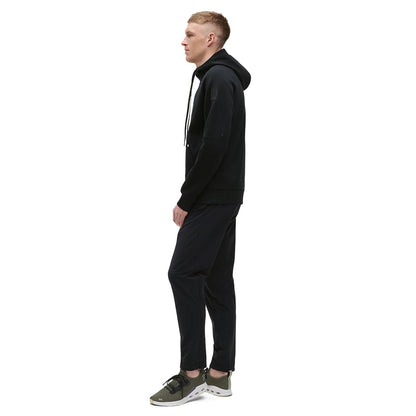Man wearing the On Zipped Hoodie Colour black - Side Profile 