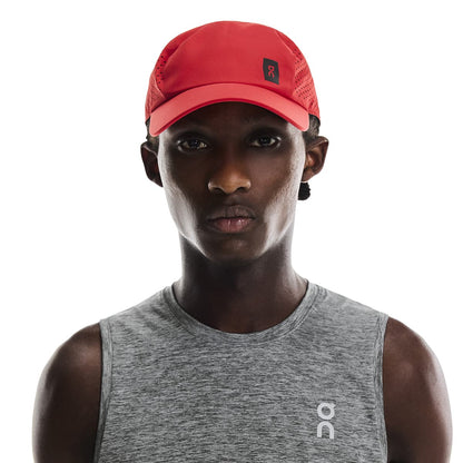 Model wearing the On Lightweight Cap Colour Red 