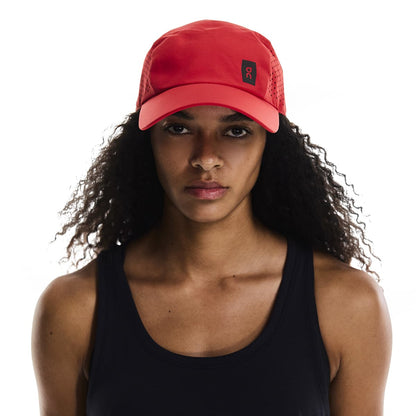 Female Model wearing the On Lightweight Cap Colour Red 