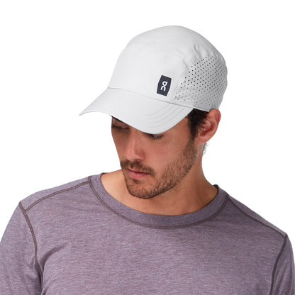 Male Model wearing the On Lightweight Cap Colour grey - Close up of Peak 