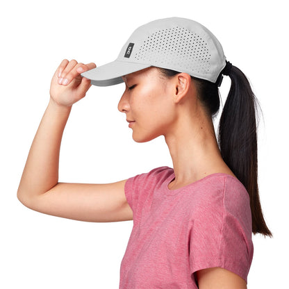 Female Model wearing the On Lightweight Cap Colour grey - Side Angle 